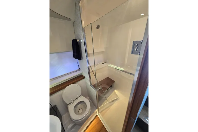 Slide: The Image of Modern bathroom in 2022 Tiara Yachts 43 LE, featuring shower and toilet. - 33