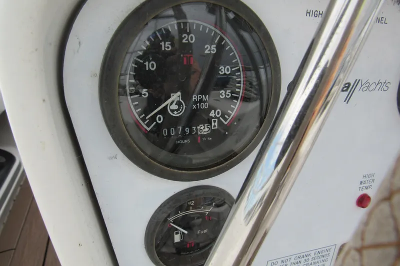 Slide: The Image of Close-up of Catalina 380 yacht's dashboard gauges, showing RPM and fuel levels. - 16