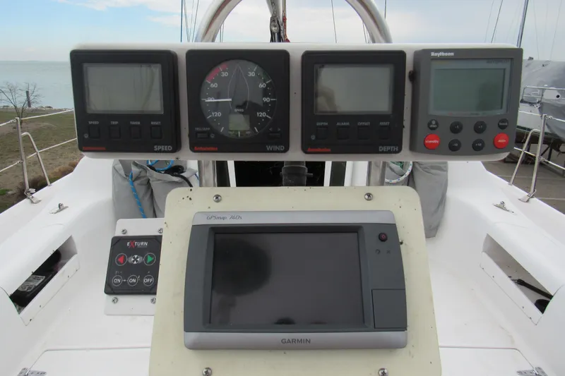 Slide: The Image of Cockpit of 1999 Catalina 380 sailboat with navigation instruments and Garmin GPS. - 17