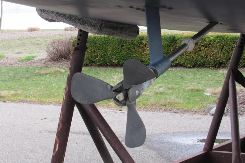 Slide: The Image of Propeller of a 1999 Catalina 380 sailboat on a stand outdoors. - 20