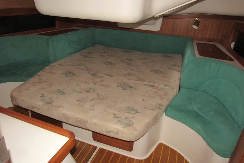 Slide: The Image of Interior of a 1999 Catalina 380 sailboat with a convertible dinette bed. - 34