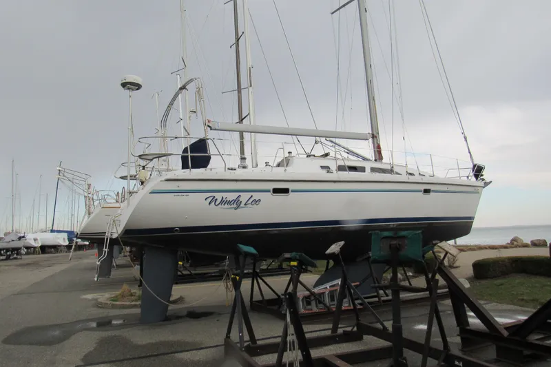 Slide: The Image of 1999 Catalina 380 sailboat "Windy Lee" on dry dock near the shoreline. - 4