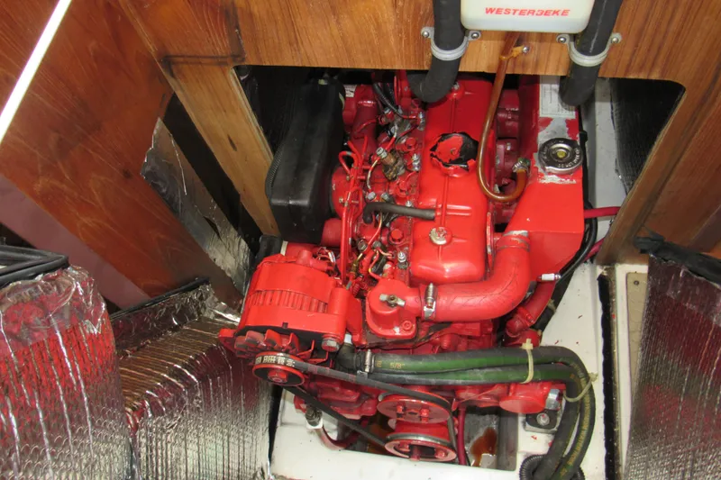 Slide: The Image of Engine compartment of a 1999 Catalina 380 sailboat with a red Westerbeke engine. - 41