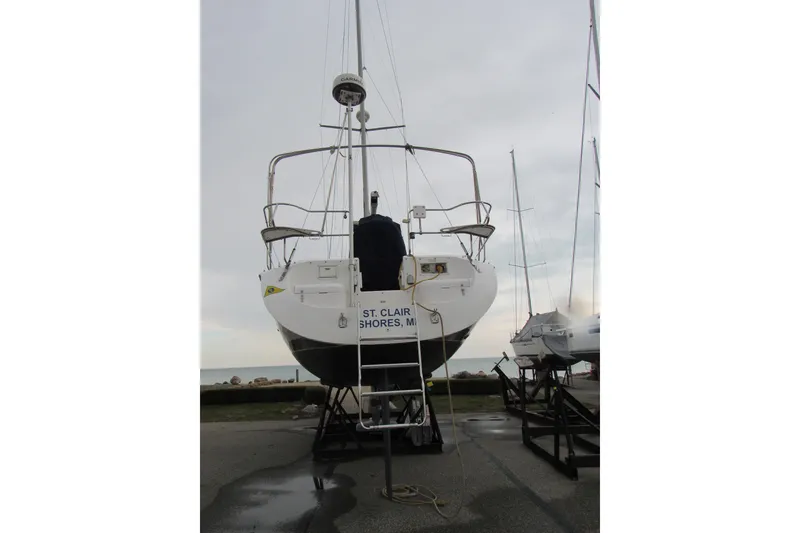 Slide: The Image of 1999 Catalina 380 sailboat on stands, St. Clair Shores, Michigan, overcast sky. - 6
