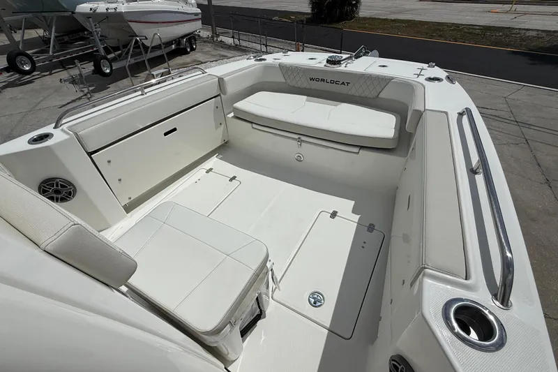 Slide: The Image of 2026 World Cat 235 TE boat interior with seating and storage compartments. - 7