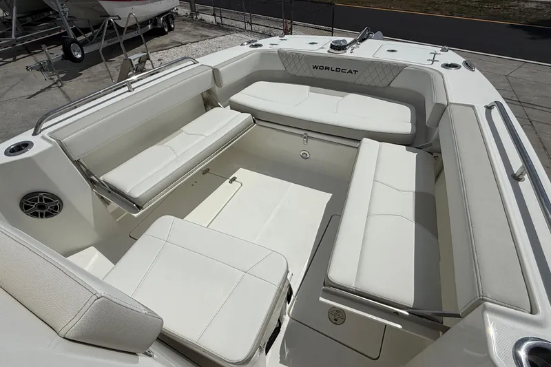 Slide: The Image of Spacious seating area on 2026 World Cat 235 TE boat, featuring white cushioned benches. - 8