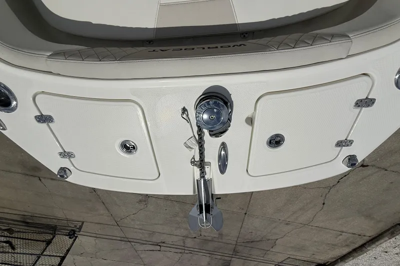 Slide: The Image of 2026 World Cat 235 TE boat deck with anchor and storage compartments. - 9