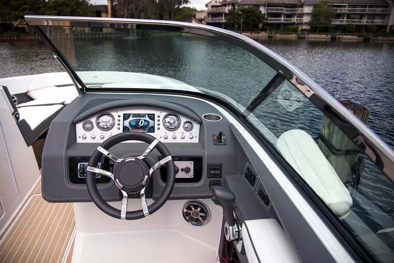 Slide: The Image of Manufacturer Provided Image: 2017 Regal 2800 Bowrider boat dashboard with steering wheel and controls. - 10