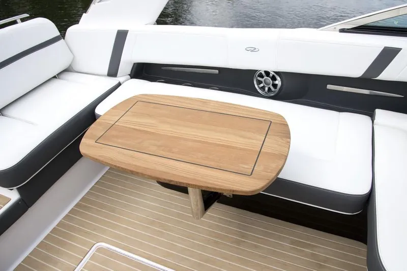 Slide: The Image of Manufacturer Provided Image: 2017 Regal 2800 Bowrider interior with wooden table and white seating. - 11