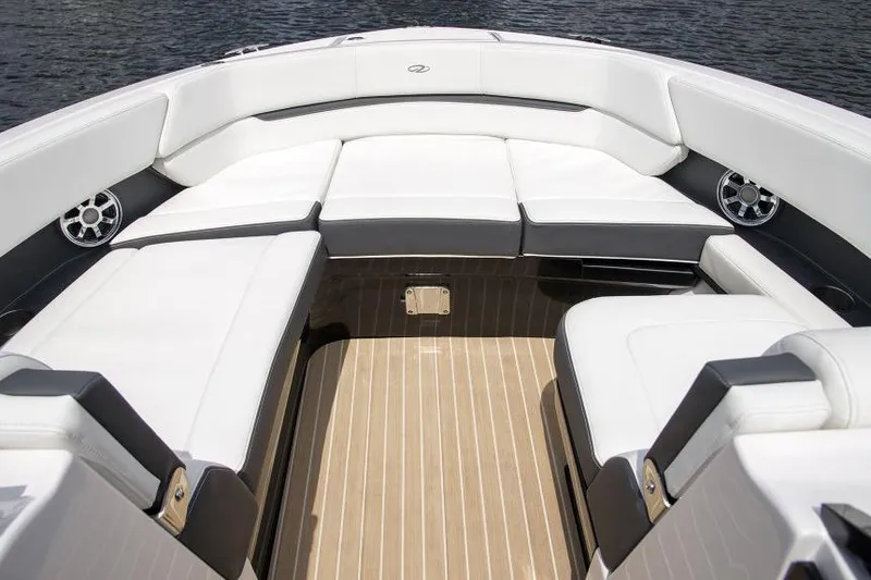Slide: The Image of Manufacturer Provided Image: 2017 Regal 2800 Bowrider boat interior with white cushioned seating. - 8