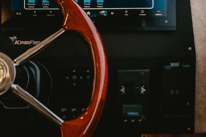 Slide: The Image of Steering wheel and dashboard of 2026 KingFisher 38 GFX boat. - 12