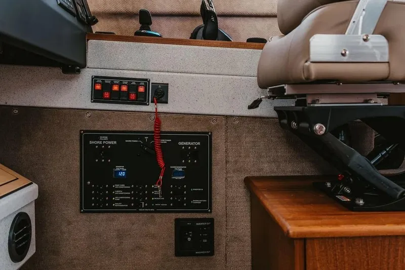 Slide: The Image of Control panel and seating inside a 2026 KingFisher 38 GFX boat. - 14