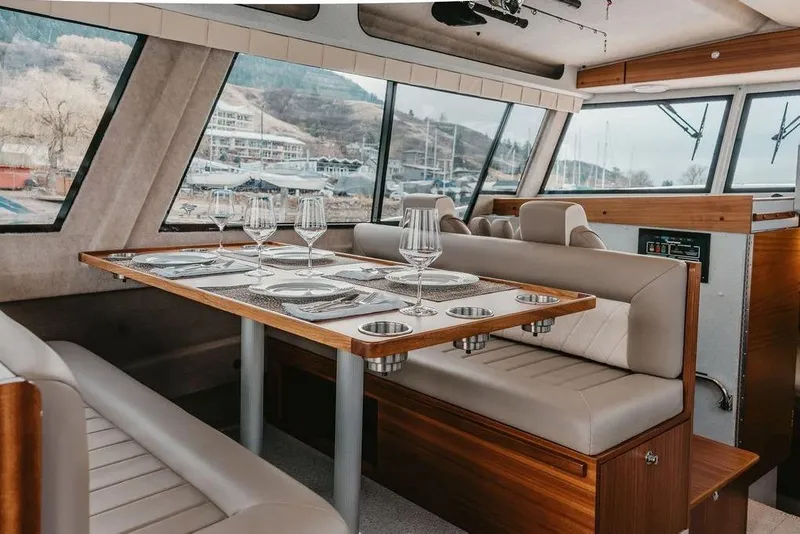 Slide: The Image of Luxurious interior of 2026 KingFisher 38 GFX yacht with elegant dining setup. - 15