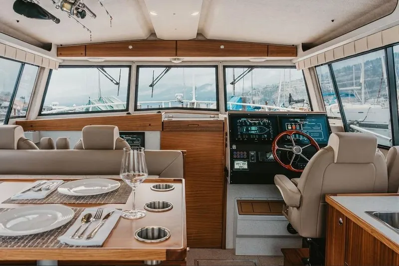 Slide: The Image of Interior of 2026 KingFisher 38 GFX boat with dining area and helm. - 16