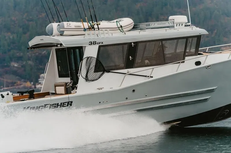 Slide: The Image of 2026 KingFisher 38 GFX boat cruising on water with fishing gear. - 4