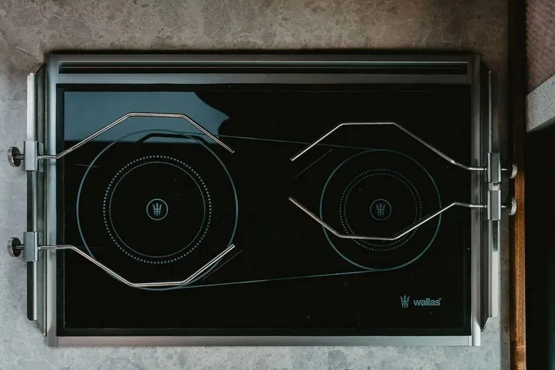 Slide: The Image of Modern stovetop on KingFisher 38 GFX, 2026 model, featuring sleek design and dual burners. - 6