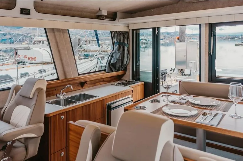 Slide: The Image of Luxurious interior of 2026 KingFisher 38 GFX yacht with dining area and kitchenette. - 8