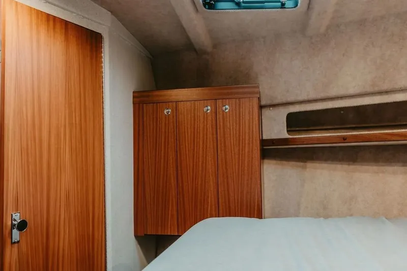 Slide: The Image of Interior cabin of 2026 KingFisher 38 GFX boat with wooden cabinetry. - 9