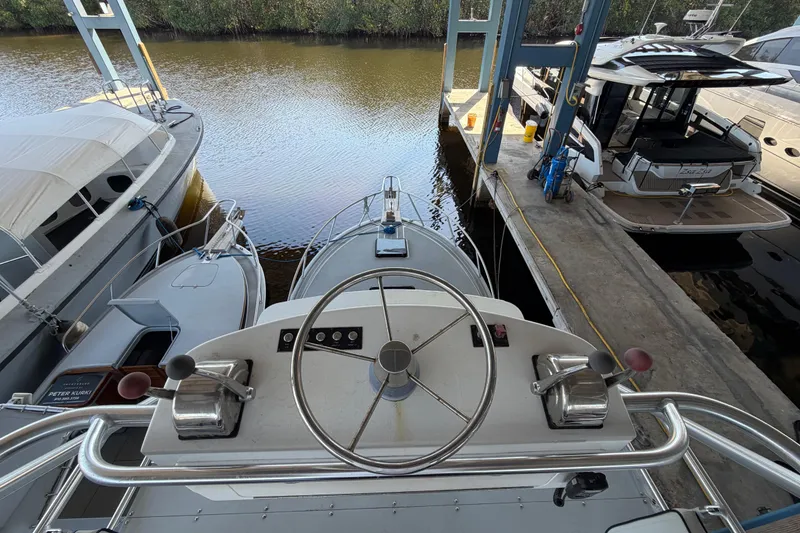 Slide: The Image of 2024 Strike 29 FT Center Console with Cuddy at marina dock, aerial view. - 11