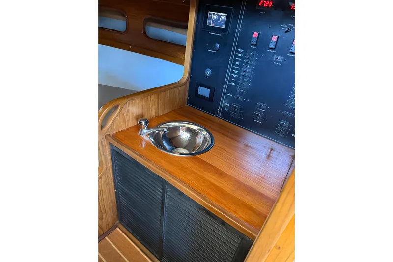 Slide: The Image of 2024 Strike 29 FT Center Console interior with sink and control panel. - 14