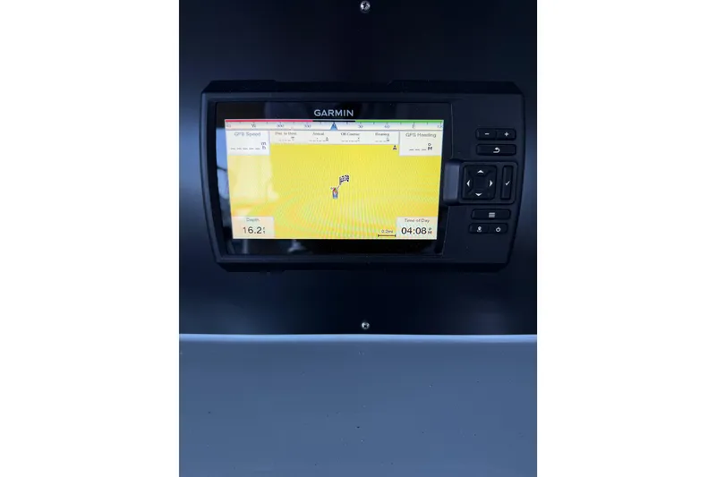 Slide: The Image of 2024 Strike 29 FT Center Console with Cuddy, featuring sleek helm and wooden accents. - 28