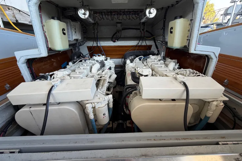 Slide: The Image of 2024 Strike 29 Center Console boat engine compartment with wiring and Cummins component. - 32