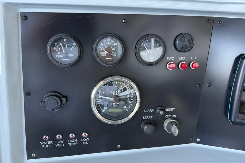 Slide: The Image of Control panel of 2024 Strike 29 FT Center Console boat with gauges and switches. - 7