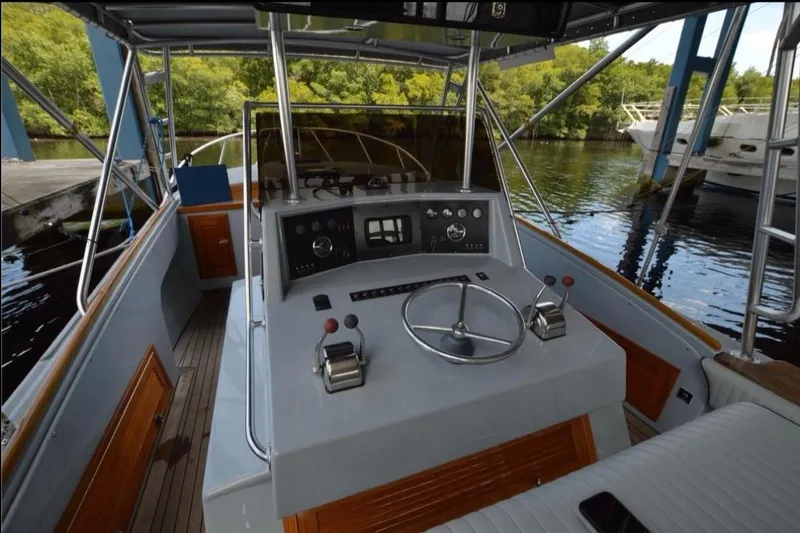 Slide: The Image of 2024 Strike 29 FT Center Console with Cuddy docked among other boats at marina. - 29