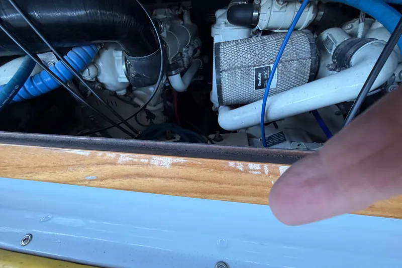 Slide: The Image of 2024 Strike 29 FT Center Console boat engine compartment with cuddy, showcasing dual engines. - 31