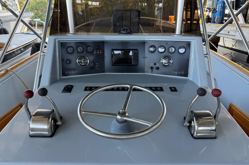 Slide: The Image of 2024 Strike 29 FT Center Console with Cuddy, docked, showcasing sleek design. - 42