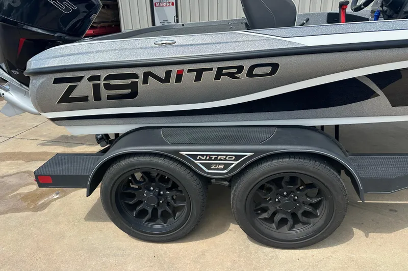 Slide: The Image of 2023 Nitro Z19 boat trailer with black wheels and sleek design. - 3