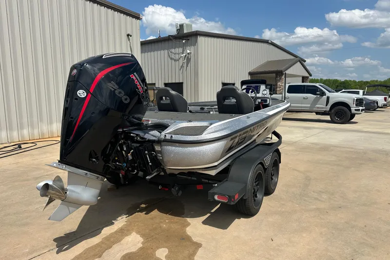 Slide: The Image of 2023 Nitro Z19 boat with powerful engine, parked outdoors on a sunny day. - 4