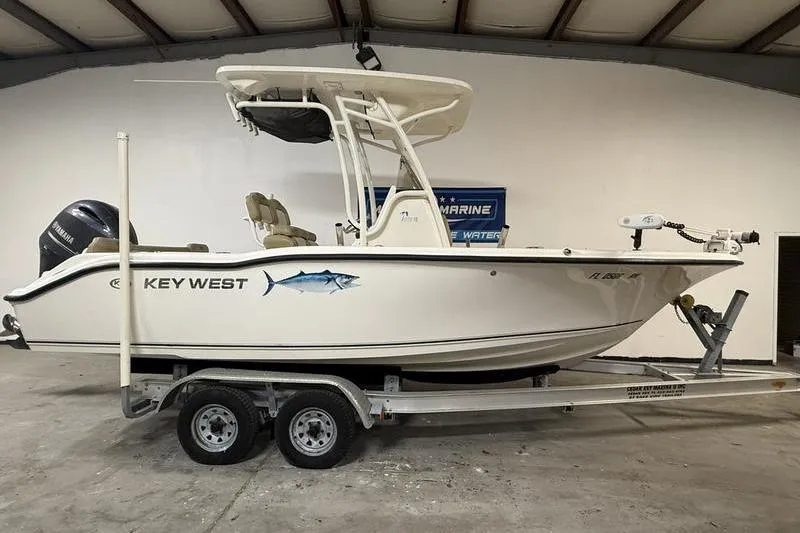The Image of 2018 Key West 219 FS boat on trailer in indoor storage. - 0