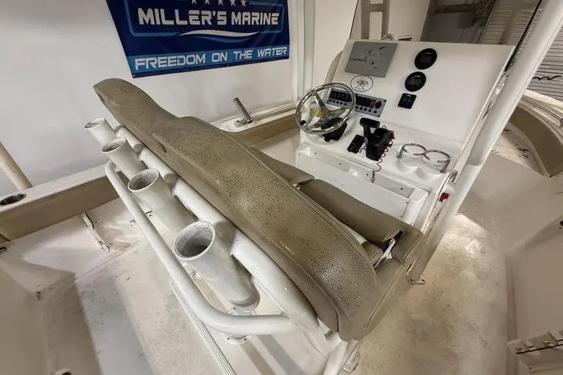 Slide: The Image of 2018 Key West 219 FS boat console with seating and fishing rod holders. - 11