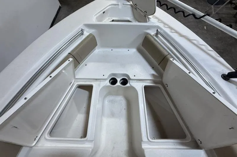 Slide: The Image of 2018 Key West 219 FS boat interior with storage compartments and seating. - 14
