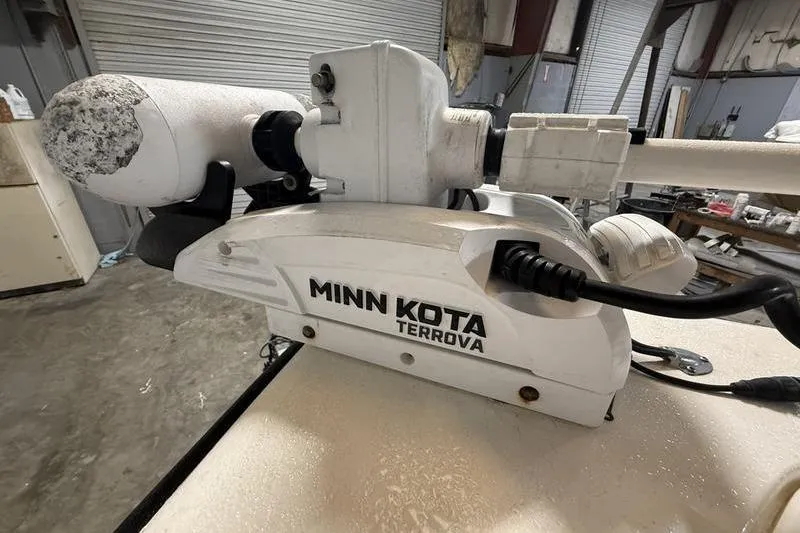 Slide: The Image of Minn Kota Terrova trolling motor on 2018 Key West 219 FS boat in a garage. - 15