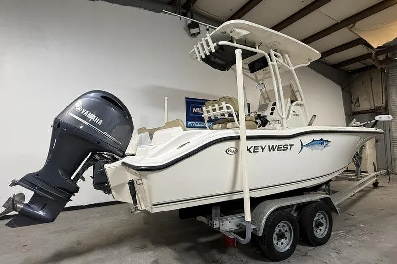 Slide: The Image of 2018 Key West 219 FS boat with Yamaha engine on trailer in garage. - 3