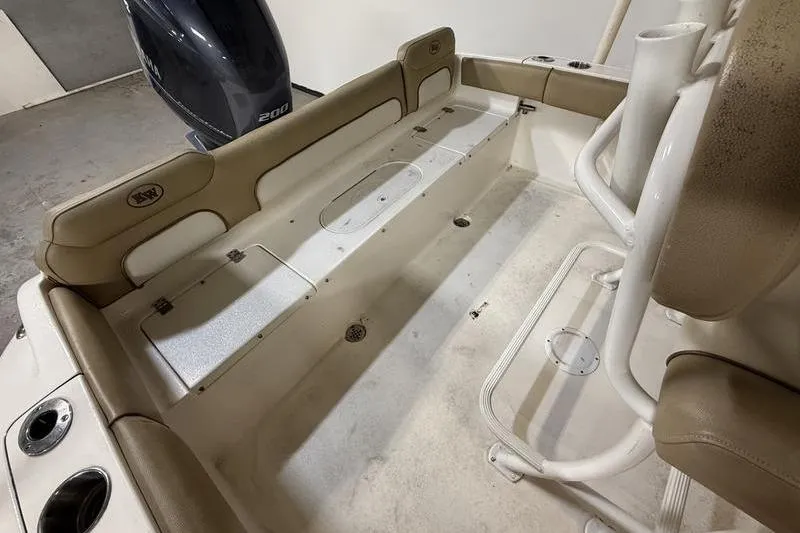 Slide: The Image of Interior view of a 2018 Key West 219 FS boat with seating and storage compartments. - 4