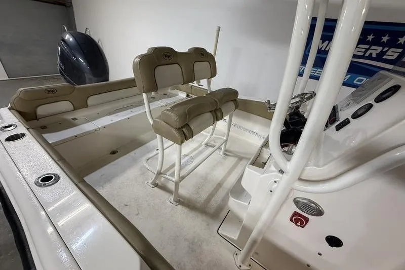 Slide: The Image of 2018 Key West 219 FS boat interior with seating and control panel. - 6