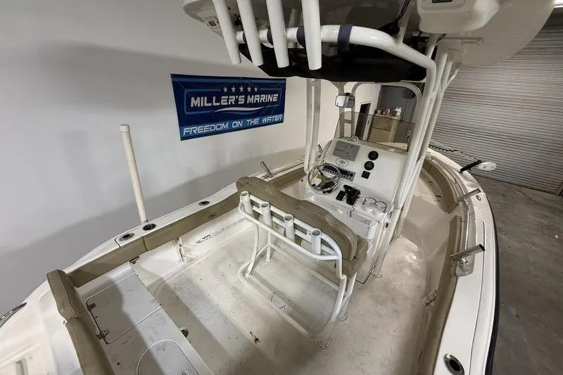 Slide: The Image of 2018 Key West 219 FS boat interior with console and seating, displayed at Miller's Marine. - 8