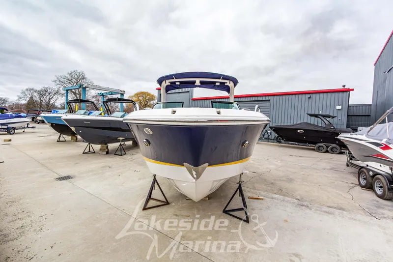 Slide: The Image of 2021 Chaparral 267 SSX boat displayed at Lakeside Marina, surrounded by other boats. - 10