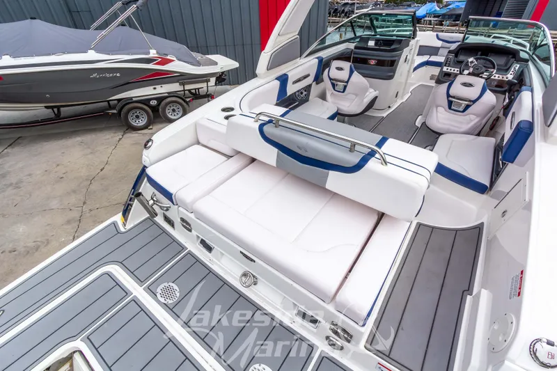Slide: The Image of 2021 Chaparral 267 SSX boat interior with luxurious seating and modern dashboard. - 12