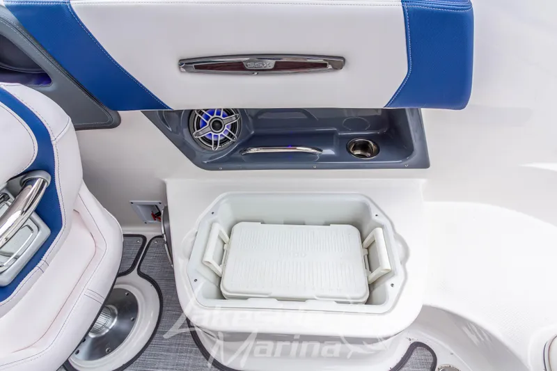 Slide: The Image of 2021 Chaparral 267 SSX boat interior with cooler and speaker detail. - 17
