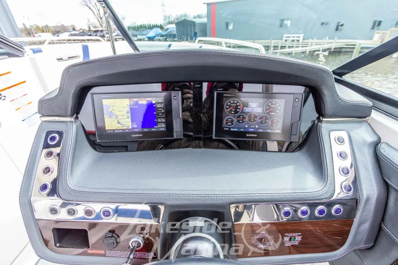 Slide: The Image of Dashboard of 2021 Chaparral 267 SSX boat with Garmin navigation displays. - 22