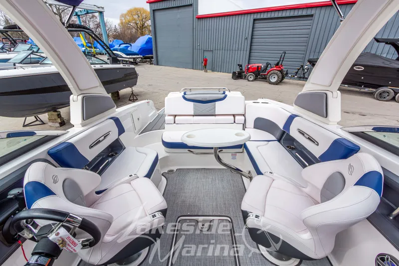 Slide: The Image of Interior of 2021 Chaparral 267 SSX boat with luxurious seating and table. - 30