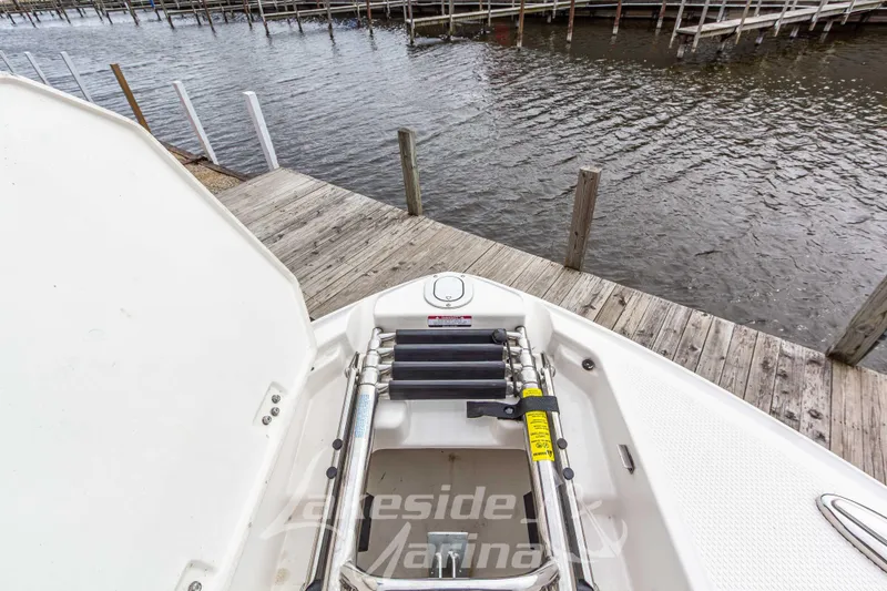 Slide: The Image of 2021 Chaparral 267 SSX boat ladder and dock view. - 39