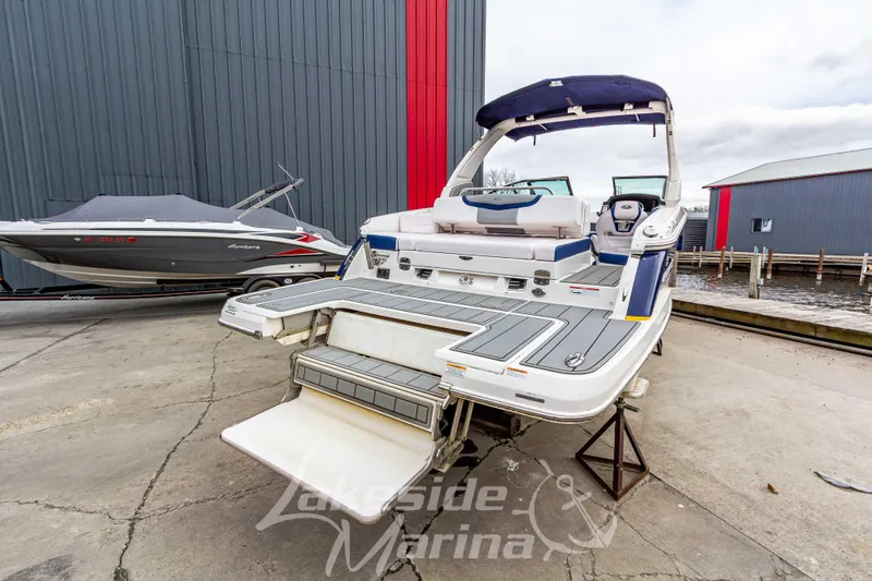 Slide: The Image of 2021 Chaparral 267 SSX boat displayed at Lakeside Marina, featuring a sleek design. - 4