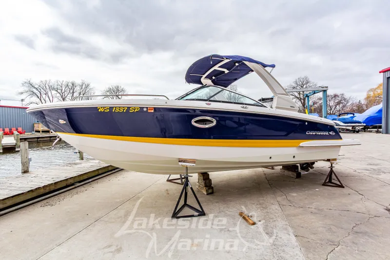 Slide: The Image of 2021 Chaparral 267 SSX boat on display at Lakeside Marina, featuring sleek design and vibrant colors. - 9