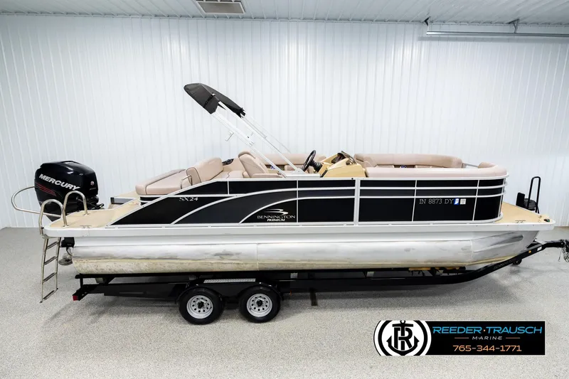 The Image of 2018 Bennington 24 SSBXPDL pontoon boat with Mercury engine on trailer. - 1