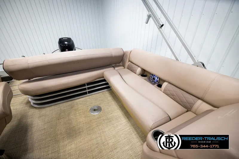 Slide: The Image of 2018 Bennington 24 SSBXPDL pontoon boat interior with beige seating and speaker system. - 21